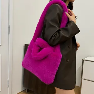 Bright pink faux fur shoulder bag detail, fluffy plush tote handbag for women fashion style.