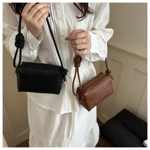 Woven shoulder crossbody bag, stylish women small square handbag with knotted strap design.