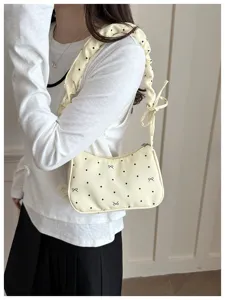 Chic light yellow shoulder bag with cute ruffles, polka dots, and bow prints for daily use.