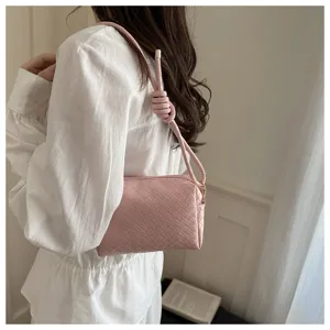 Pink woven shoulder bag detail, stylish knotted strap design, chic daily crossbody handbag view.