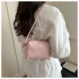 Pink woven leather shoulder bag detail, elegant casual crossbody purse with knot.