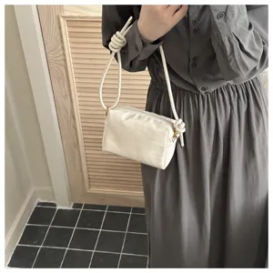 Chic white woven crossbody camera bag, stylish shoulder bag with knot strap, elegant daily purse