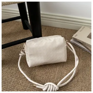 Detailed view of the stylish woven crossbody bag, showcasing intricate texture and quality craftsmanship.