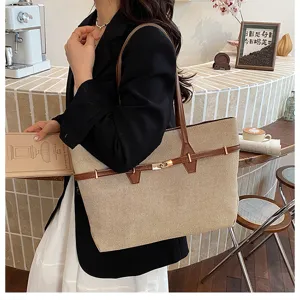 Retro large capacity canvas shoulder tote bag for women, stylish commuting underarm bag.