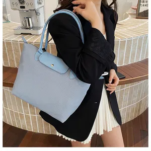Stylish women's shoulder handbag with top handle and flap design, versatile daily commuter tote bag.