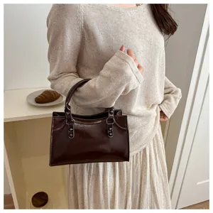 Retro patent leather handbag for women, elegant solid color shoulder bag, chic commuter tote.