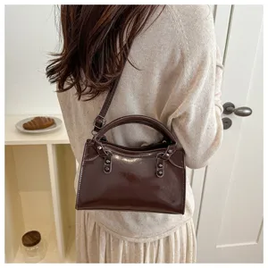 Retro patent leather shoulder crossbody bag for women with chic metal rivet details stylish