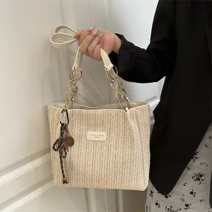 Casual straw tote bag for women with metal chain straps and chic design for daily wear.