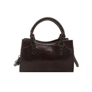 Retro solid color patent leather top handle handbag for women, chic commuter shoulder crossbody bag.