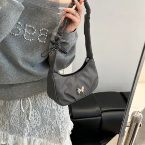 Grey ruched shoulder bag with cute metal butterfly charm, stylish hobo purse for women.