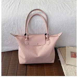 Pink pleated tote bag for women, stylish casual shoulder handbag with top handle and snap flap.