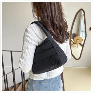 Minimalist black nylon shoulder bag, casual quilted underarm hobo bag for daily wear and travel.