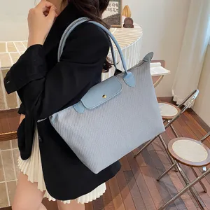 Stylish casual commuter shoulder tote bag for women, large capacity light blue handbag for daily.