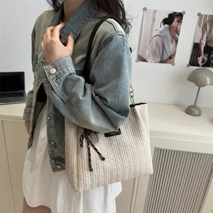 Casual woven straw shoulder tote bag for women, stylish summer beach vacation handbag.