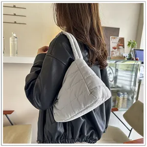 Stylish nylon shoulder bag for women, casual lightweight solid color hobo axillary bag for daily commute.