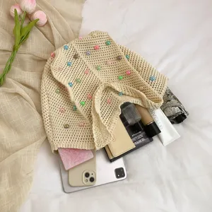Beige knitted tote bag for women, stylish pearl beaded shoulder bag for beach vacation and daily commute.