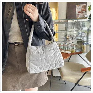 Casual lightweight nylon shoulder bag with quilted design, simple underarm style.