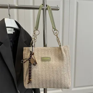 Woven straw shoulder tote bag with green chain straps for women beach vacation bag.