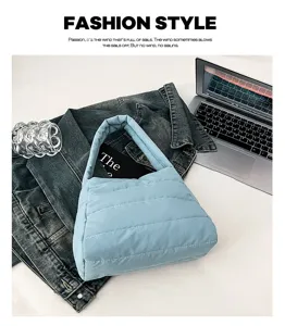 Detail view of the lightweight casual nylon shoulder bag in solid light blue with quilted design.