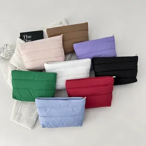 Multi-color quilted puffer cosmetic bag, stylish soft cotton clutch and everyday storage pouch.