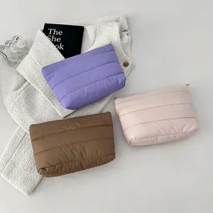 Padded clutch bag set in purple, brown and pink solid colors, minimalist style for women.
