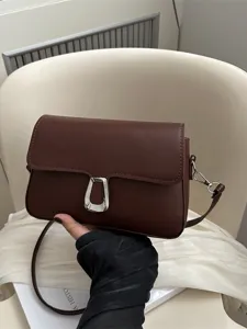 Vintage brown leather shoulder bag for women, elegant crossbody small square bag for daily use.