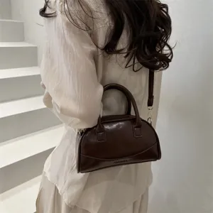 Chic brown boston handbag for women, minimalist PU leather crossbody bag with top handle.