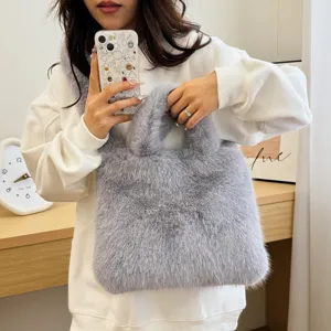 Detail shot of fluffy grey plush handbag, soft faux fur texture, cozy autumn winter accessory.