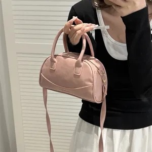 Pink boston shoulder bag for women, PU leather fashion handbag with top handle and strap.