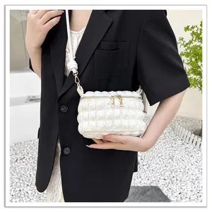 Mini white puffy pleated crossbody bag, cute cloud handbag with secure zipper closure.