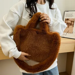 Cozy brown fluffy faux fur handbag for women, stylish winter plush shoulder tote bag.