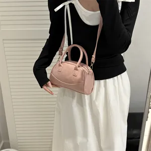 Pink Boston handbag for women, stylish PU leather shoulder bag with top handles.
