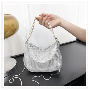 Silver rhinestone hobo bag with pearl handle and metal chain for women party evening.