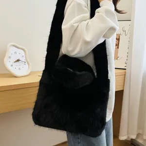 Chic black plush shoulder bag for women, fluffy faux fur crossbody tote with wide strap for autumn.