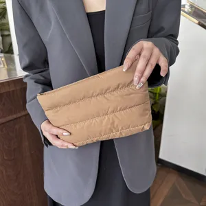 Stylish solid color quilted pouch clutch bag, minimalist design for women's daily commute.