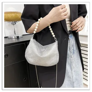 Elegant silver rhinestone evening bag with pearl handle and shoulder chain for women parties.