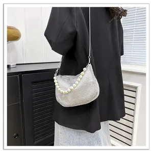Stylish silver rhinestone shoulder bag with elegant pearl handle for women evening party.