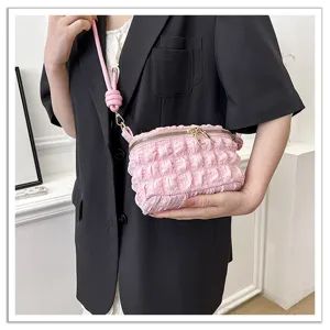 Mini pink pleated cloud shoulder bag with cute knot strap and zipper for women casual daily.