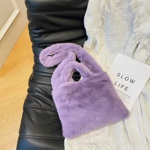 Purple fluffy shoulder bag for women, cozy plush winter handbag, stylish faux fur crossbody tote.