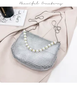 Elegant silver rhinestone evening bag with pearl handle and chain strap for women party.