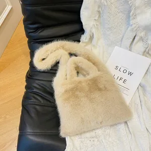 Plush fluffy shoulder handbag for women, casual winter soft faux fur tote crossbody bag design.