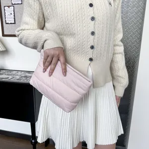Pink quilted clutch bag for women, minimalist solid color puffer design stylish purse.