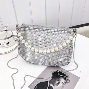 Sparkling rhinestone shoulder bag with elegant faux pearl handle and metal chain strap.