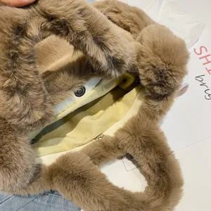 Stylish autumn winter plush tote bag for women, fluffy brown shoulder bag with soft faux fur.