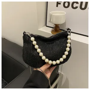 Black rhinestone hobo bag with elegant faux pearl chain strap for evening party and fashion use.