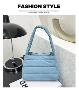 Detail view of casual nylon puffer shoulder bag in light blue, perfect daily underarm carry.