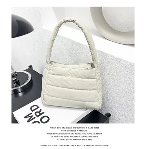 Quilted nylon shoulder bag detail, minimalist casual underarm bag in solid color design.
