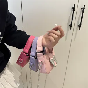 Details of cute kids mini crossbody bag with bow and chain, sweet style for little girls.