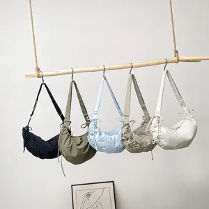 Casual nylon dumpling shoulder bag for women, chic slouchy crossbody bag with adjustable strap for daily wear.