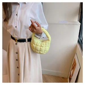 Chic yellow quilted cloud bag mini puffer handbag with soft texture for daily styling details.